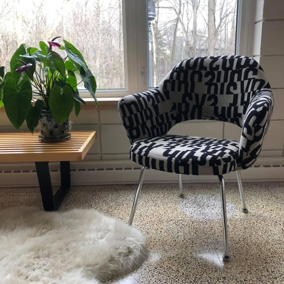 Reupholstered black and white side chair.