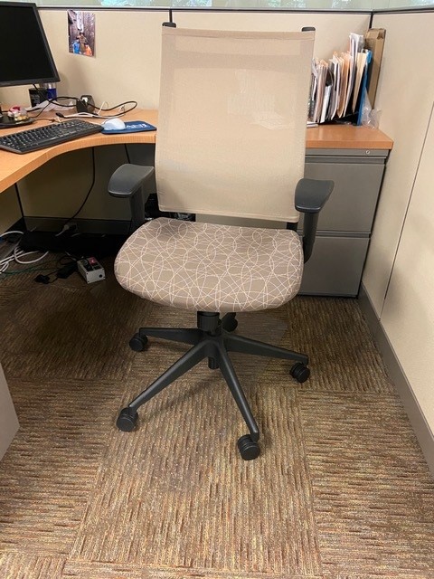 Tan mesh back desk chair