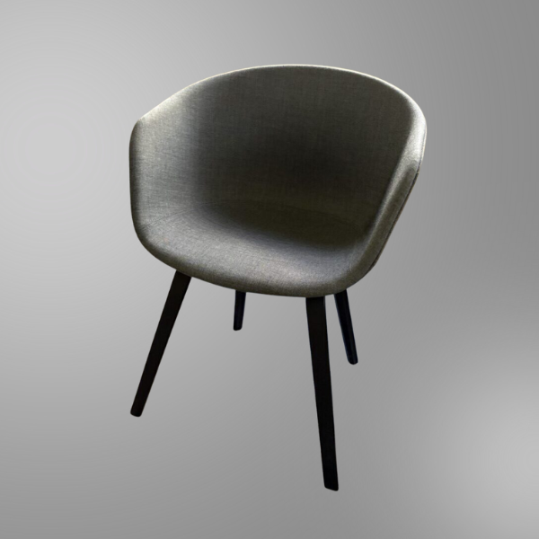 Grey bucket side chair in a grey photo background