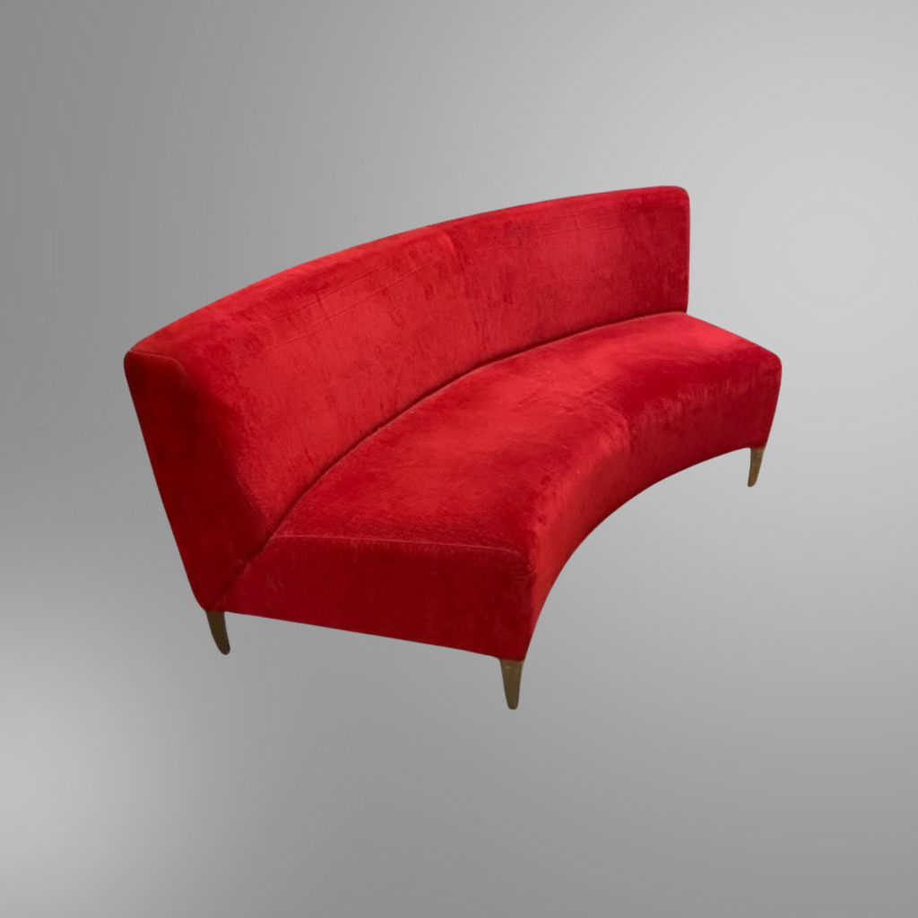 A red velvet curved sofa available in used condition at Office Furniture Resources.
