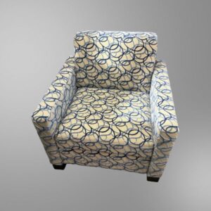 A patterned club chair by HBF in used condition