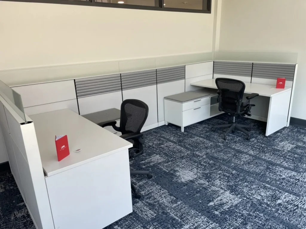 An office space furnished with used, secondhand Herman Miller Canvas Cubicle workstations