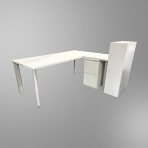 An all-white L-shape desk